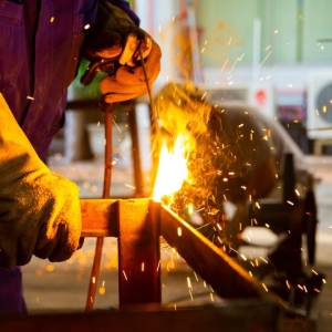 MMA welding, Welder is assembling the workpiece by process shielded metal arc welding (SMAW).